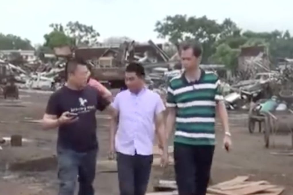 Customs police arrest a suspect as part of a series of raids to clamp down on illegal sales of scrap steel. Photo: CCTV