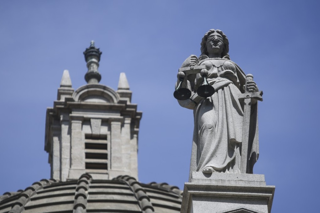 The blindfolded statue of Lady Justice, the Greek goddess Themis, outside the Court of Final Appeal in Central. On June 1, the Court of Appeal ruled to deny immigration officer Angus Leung Chun-kwong access to spousal benefits for his same-sex partner, whom he married in New Zealand in 2014. Photo: Sam Tsang