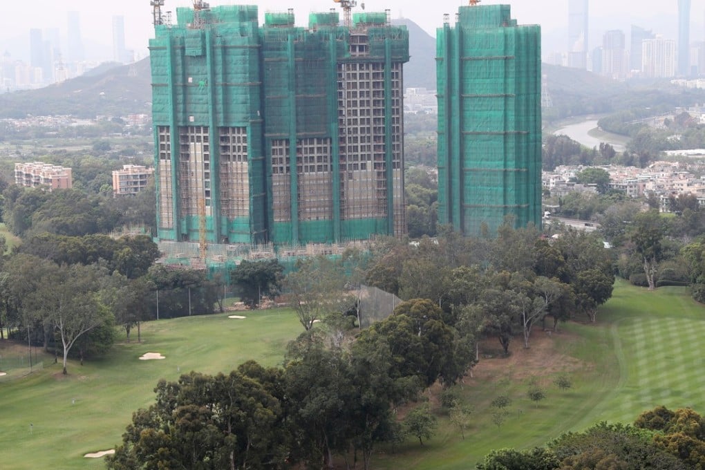 The greens of the Hong Kong Golf Club in Fanling, with a residential project coming up next to it. Even if its courses were taken over for housing, there would still not be enough land for decent homes. Photo: K. Y. Cheng
