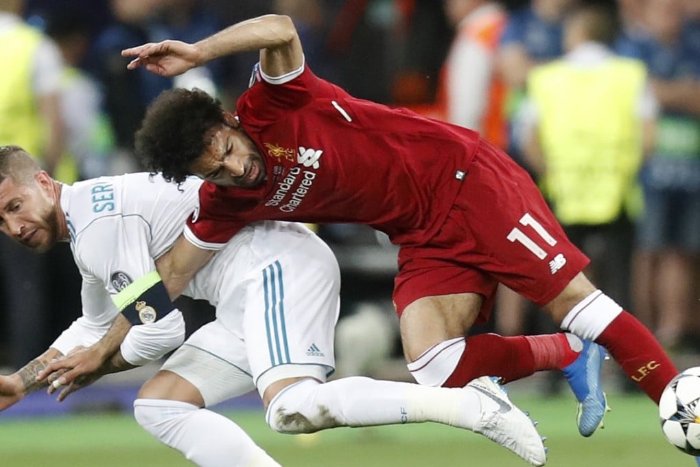 Sergio Ramos drags Mohamed Salah to the ground during the Champions League final. Photo: AP