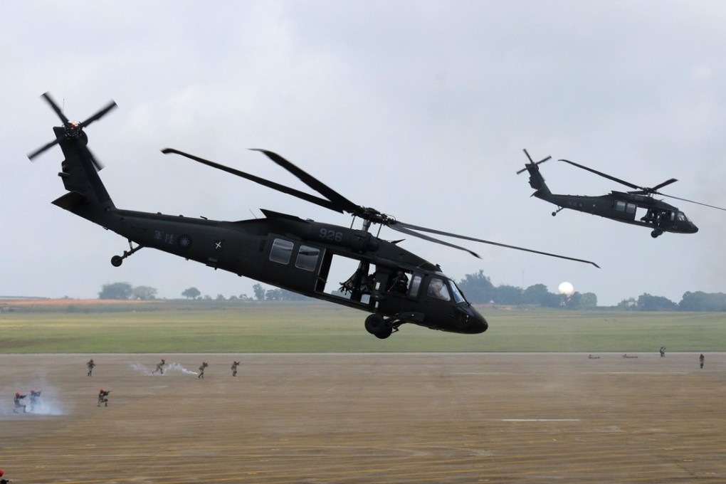 UH-60 Black Hawk helicopters take part in the Han Kuang drills at the Ching Chuan Kang airbase in Taichung on Thursday. Photo: AFP