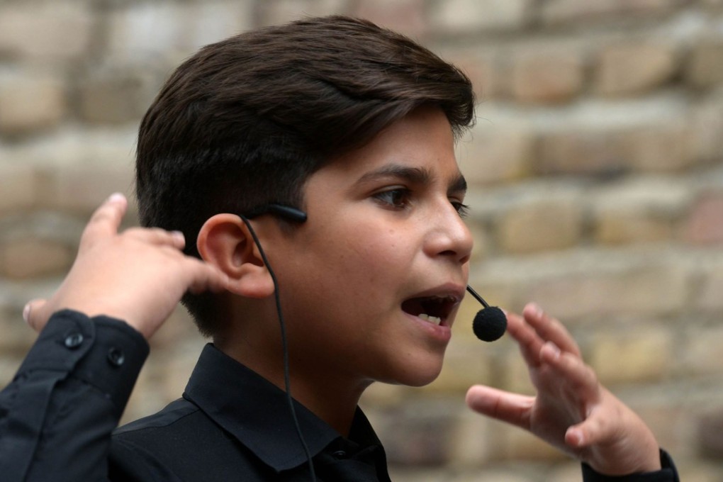 Motivational coach Hammad Safi lectures students at a languages academy in Peshawar. Photo: AFP