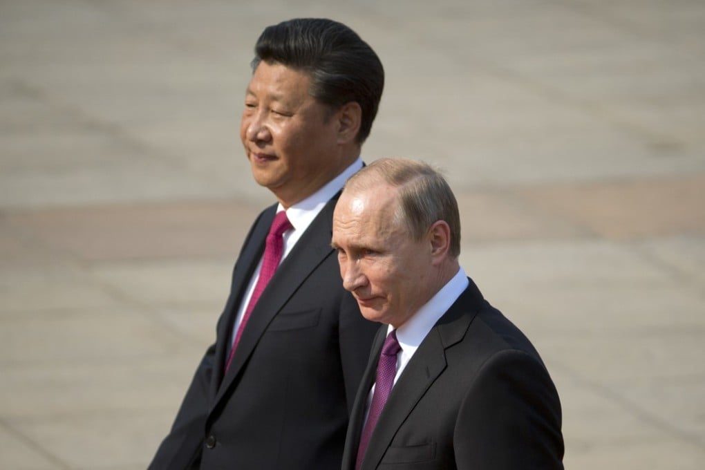 A file picture of Chinese President Xi Jinping (left) walking with his Russian counterpart Vladimir Putin during a visit to Beijing. Photo: Associated Press