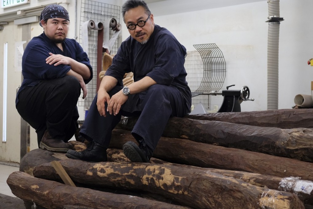 Jacky Lam (left) and Ho Siu-kee with the wood now waiting to be transformed into Chinese-style furniture at the Department of Fine Arts, Chinese University of Hong Kong Photo: Courtesy of Ho Siu-kee