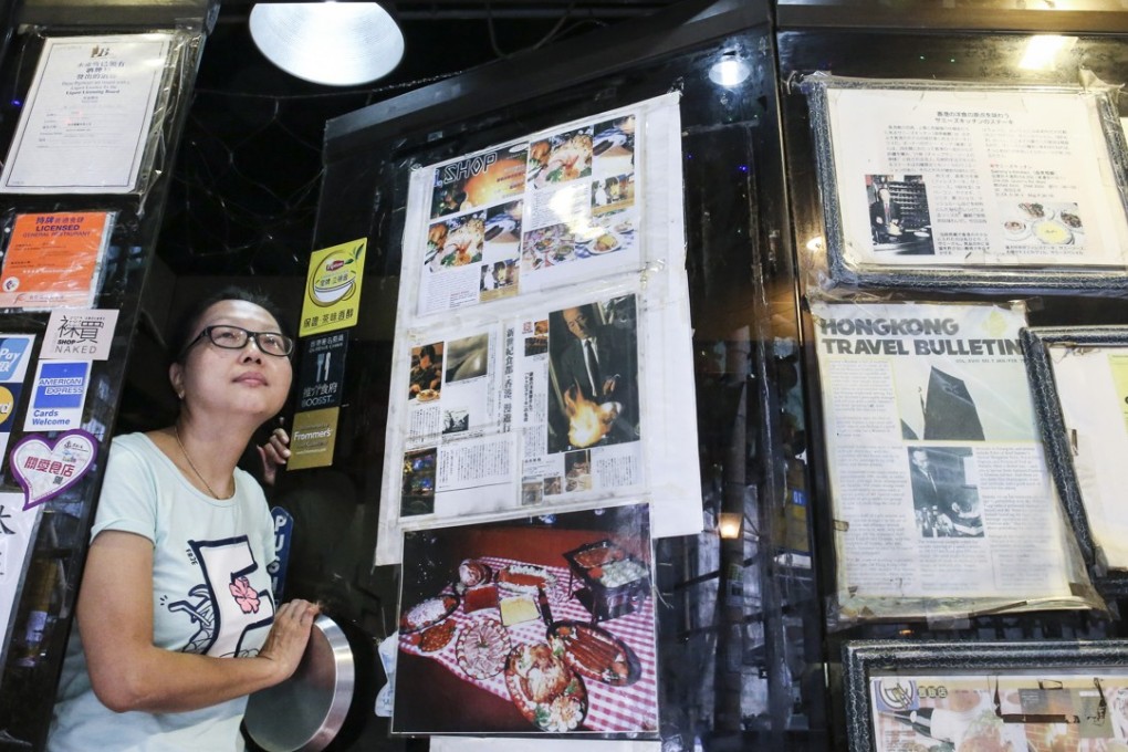 Ivy Yip at the door of Sammy’s Kitchen, a landmark of Hong Kong’s Western district that has survived a big rent increase. Photo: K.Y. Cheng