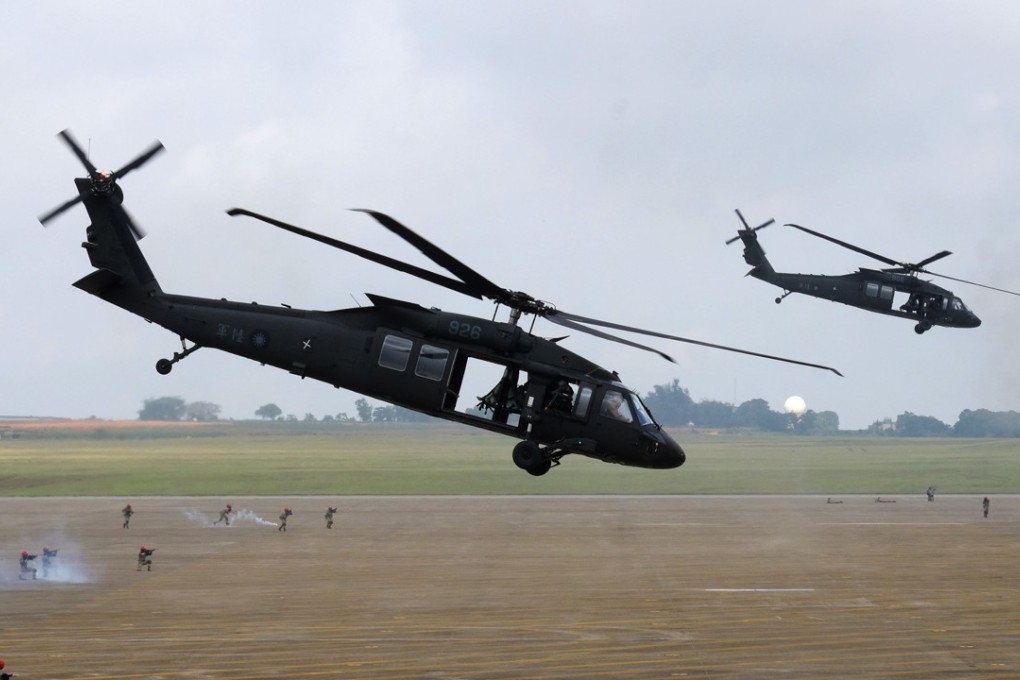 A pair of UH-60 Black Hawk helicopters take part in the Han Kuang military exercise at an air force base in Taichung, central Taiwan, on June 7. The annual drills simulating Chinese attacks are the largest since they were first held in 1984 and are a response to Beijing stepping up military and diplomatic pressure on the island amid growing tensions. Photo: AFP