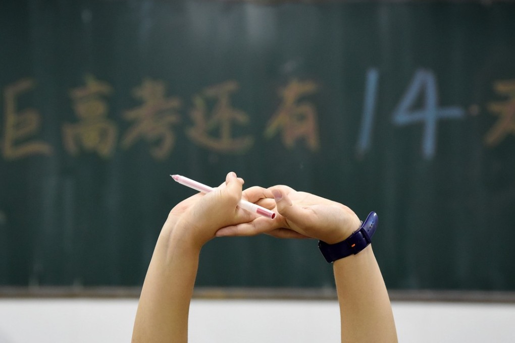 A Chinese high school student takes a brief break while studying last month for the annual 'gaokao' college entrance examinations in Handan, Hebei province, China. Photo: EPA-EFE