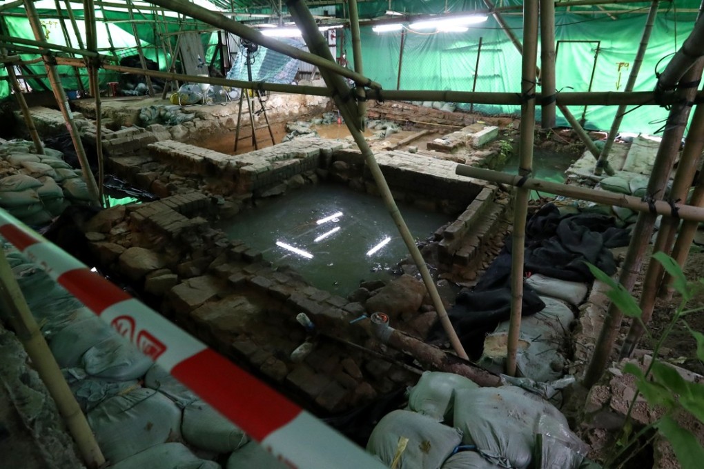 The remains of the southwest watchtower and village wall are protected from the elements. Photo: Nora Tam