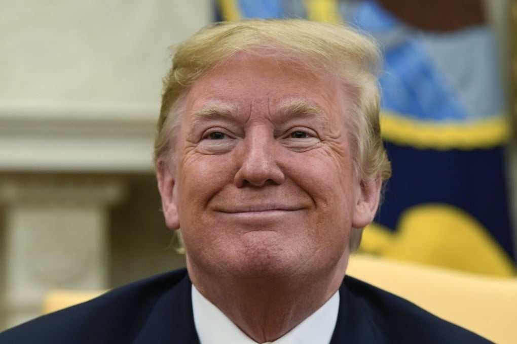 US President Donald Trump smiles during his meeting with Japanese Prime Minister Shinzo Abe in the Oval Office of the White House in Washington on Thursday. Photo AP