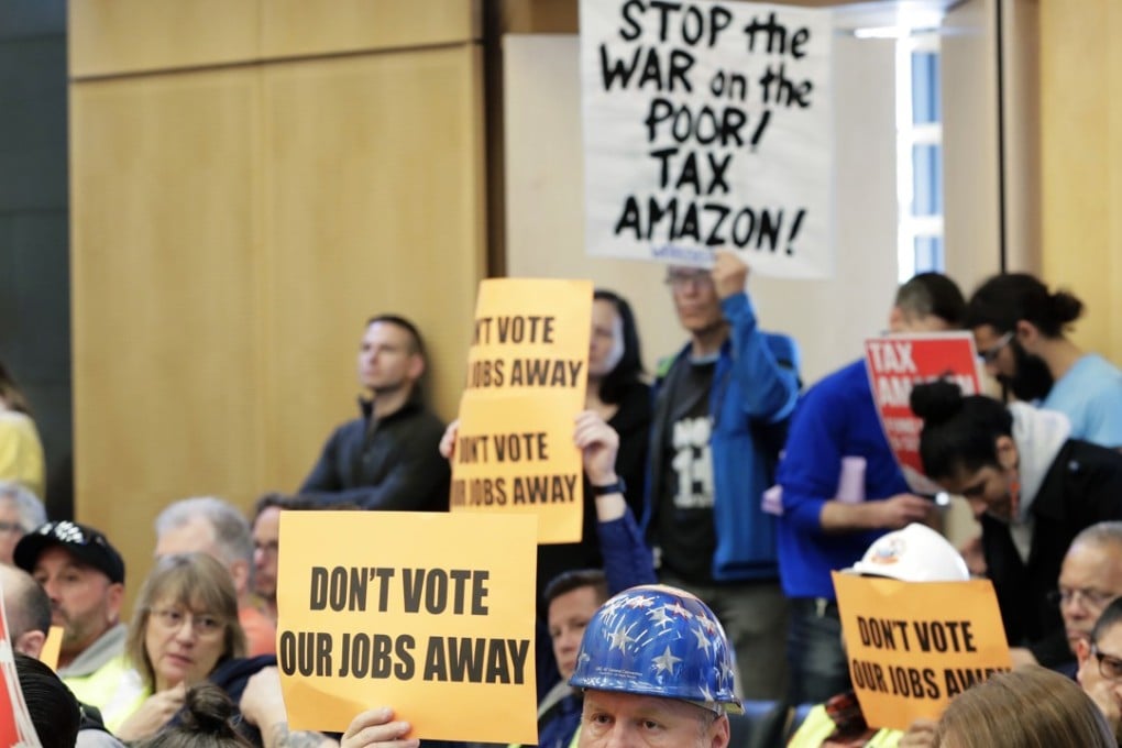 Protesters in Seattle calls for the City Council to tax large businesses such as Amazon to fund efforts to combat homelessness. Photo: AP
