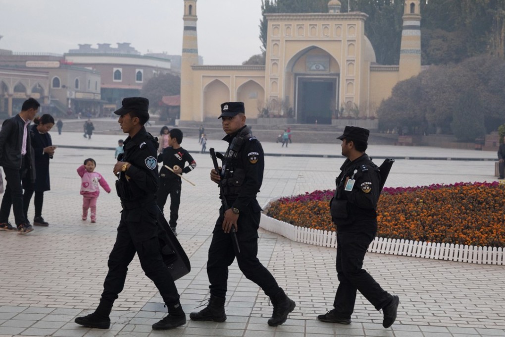 Security personnel patrol near the Id Kah Mosque in Kashgar, Xinjiang. Beijing fears the far western region and its Uygur Muslim minority could be influenced by extremism. Photo: AP
