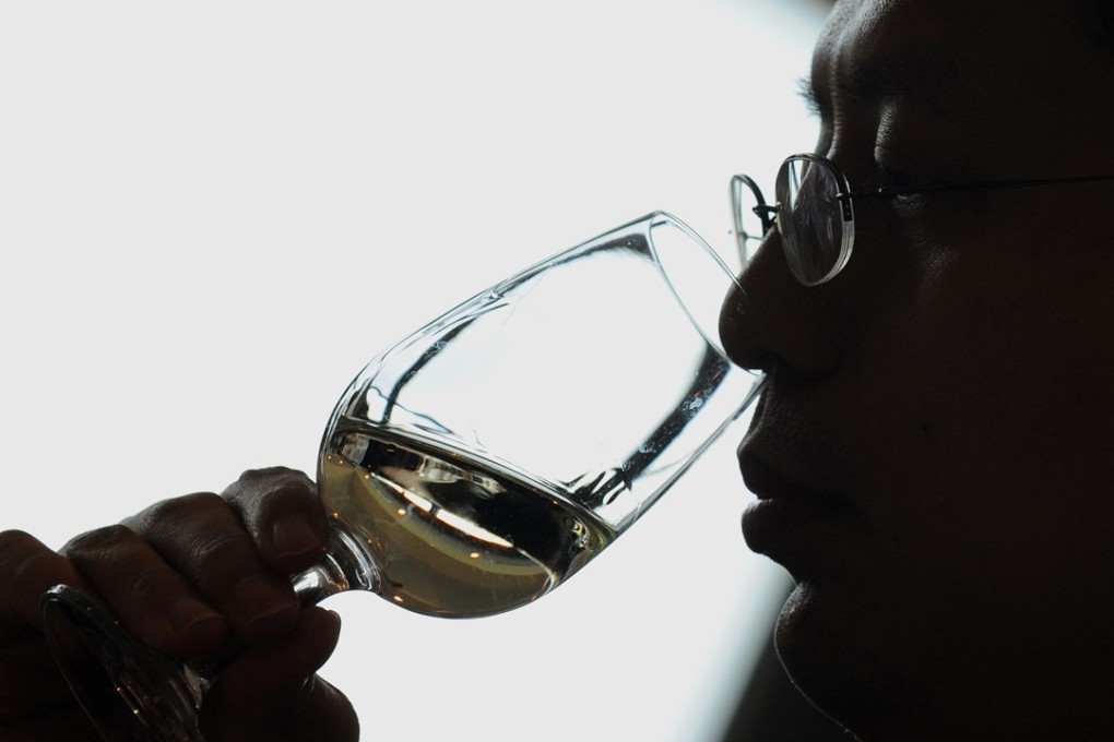 An employee of Pernod Ricard China, distributors of Jacobç Creek Wines in China, attends a wine tasting session at a Jacob's Creek Winery in South Australia's Barossa Valley. Photo: AFP