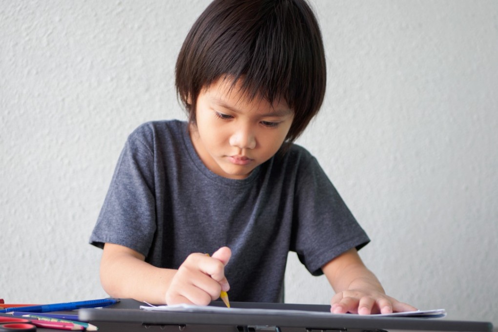 When a child wants to do their homework by themselves they are showing independence and developing their self-organisation skills. Photo: Alamy