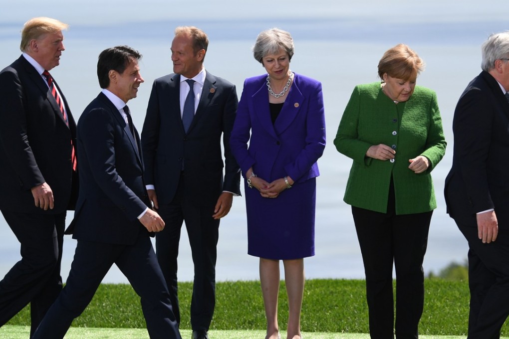 US President Donald Trump, Italian Prime Minister Giuseppe Conte, President of the European Council Donald Tusk, Britain's Prime Minister Theresa May, Germany's Chancellor Angela Merkel and President of the European Commission Jean-Claude Juncker line up for the family portrait of the G7 summit in Canada. Photo: EPA