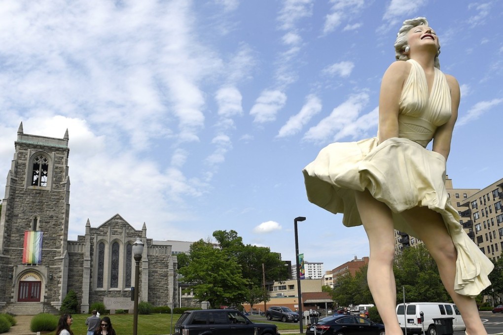 Seward Johnson's ‘Forever Marilyn’ sculpture is seen in Latham Park in Stamford, Connecticut on Thursday. The 26-foot statue that was newly installed in the park is scandalising some because her rear end is facing the entrance of the First Congregational Church. Photo: Hearst Connecticut Media via AP