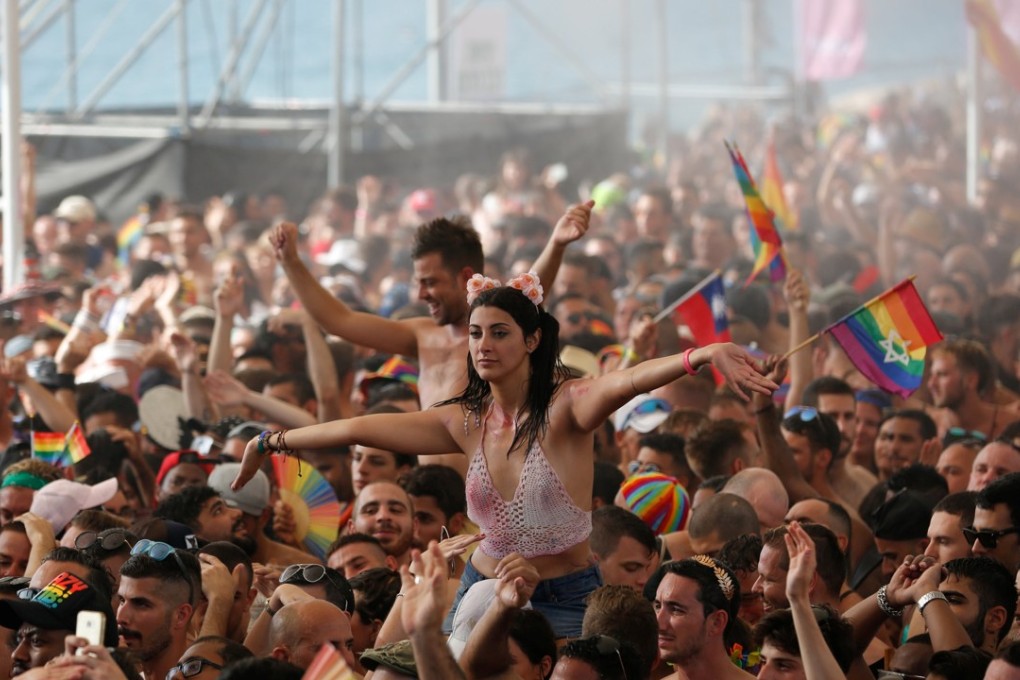 Revellers take part in a gay pride parade in Tel Aviv. Photo: Reuters