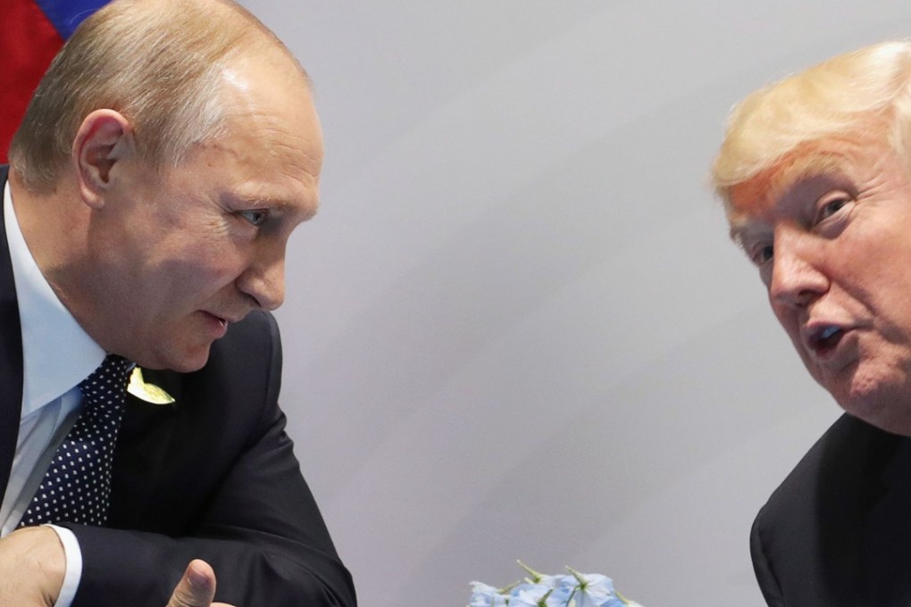 (FILES) In this file photo taken on July 7, 2017 US President Donald Trump (R) and Russia's President Vladimir Putin speak during their meeting on the sidelines of the G20 Summit in Hamburg, Germany. Donald Trump's decision to expel 60 alleged "spies" is the largest ever mass expulsion of Russian or Soviet officials from the United States, a senior administration official told AFP on March 26, 2018. "This is the largest single expulsion of Russians," including Soviet officials, the source said, underscoring the significance of the US response to the Kremlin's alleged poisoning of a former spy in England. / AFP PHOTO / SPUTNIK / Mikhail KLIMENTIEV