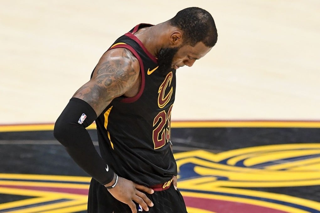 LeBron James looks dejected as the Golden State Warriors sweep the Cleveland Cavaliers. Photo: AFP