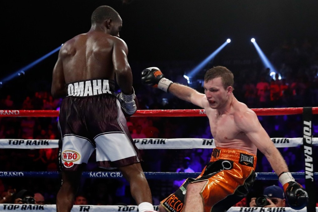 Jeff Horn stumbles to the canvas after a blow from Terence Crawford in the eighth round of their WBO welterweight title fight. Photo: AFP