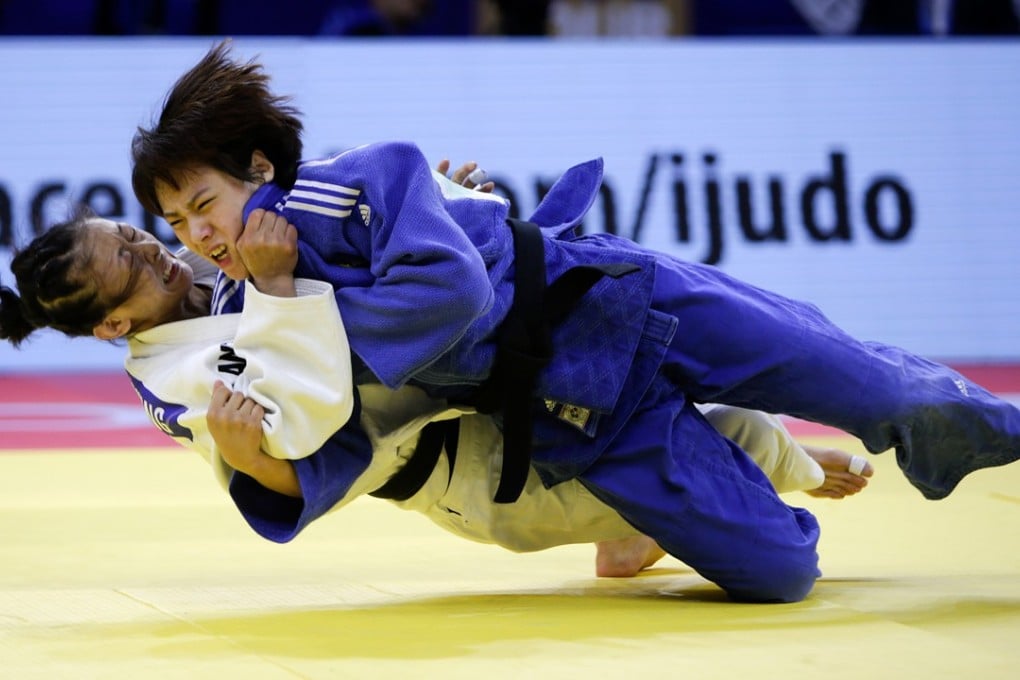 Zhang Wen (bottom) of China fights with Kwon Youjeong of South Korea during the women’s 57-kilogram competition at the 2018 IJF Judo Hohhot Grand Prix in Hohhot. Photo: Xinhua