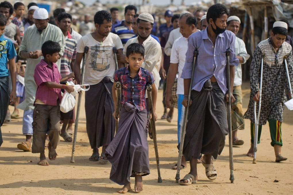 Rohingya refugees walk as they await the arrival of a UN Security Council team at the Kutupalong refugee camp in Bangladesh in April. Photo: AP