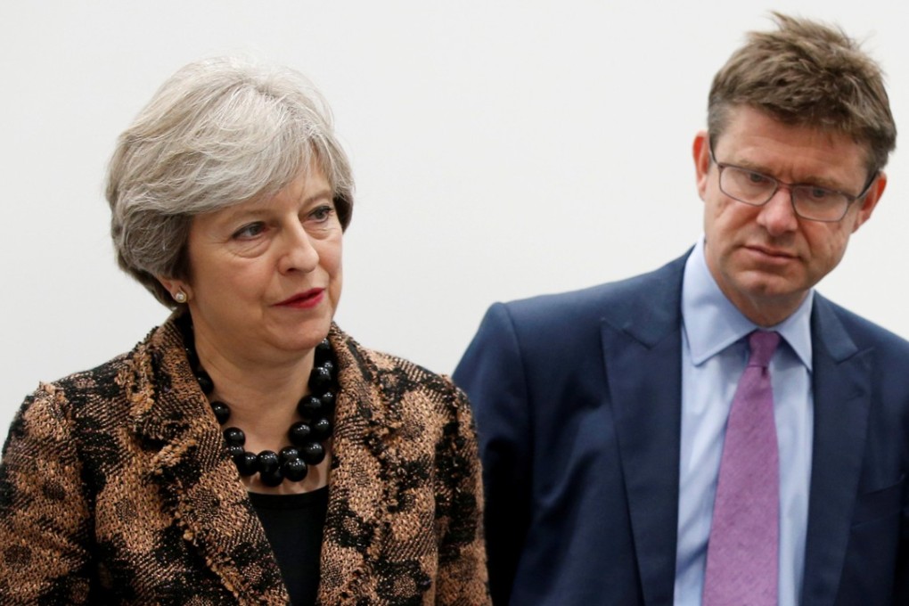 British Prime Minister Theresa May and Secretary of State for Business Greg Clark visit an engineering training facility in the West Midlands, Britain, in November 2017. Photo: Reuters