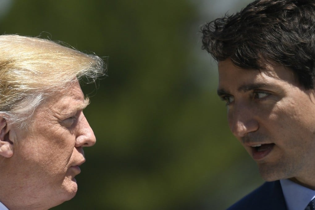US President Donald Trump (left) meets Canada's Prime Minister Justin Trudeau at the welcome ceremony at the G7 summit in Charlevoix in Canada on Friday. Photo: EPA