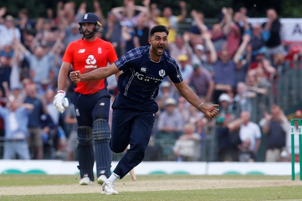 Scotland’s Safyaan Sharif celebrates winning their first one-day international match against England. Photo: Reuters