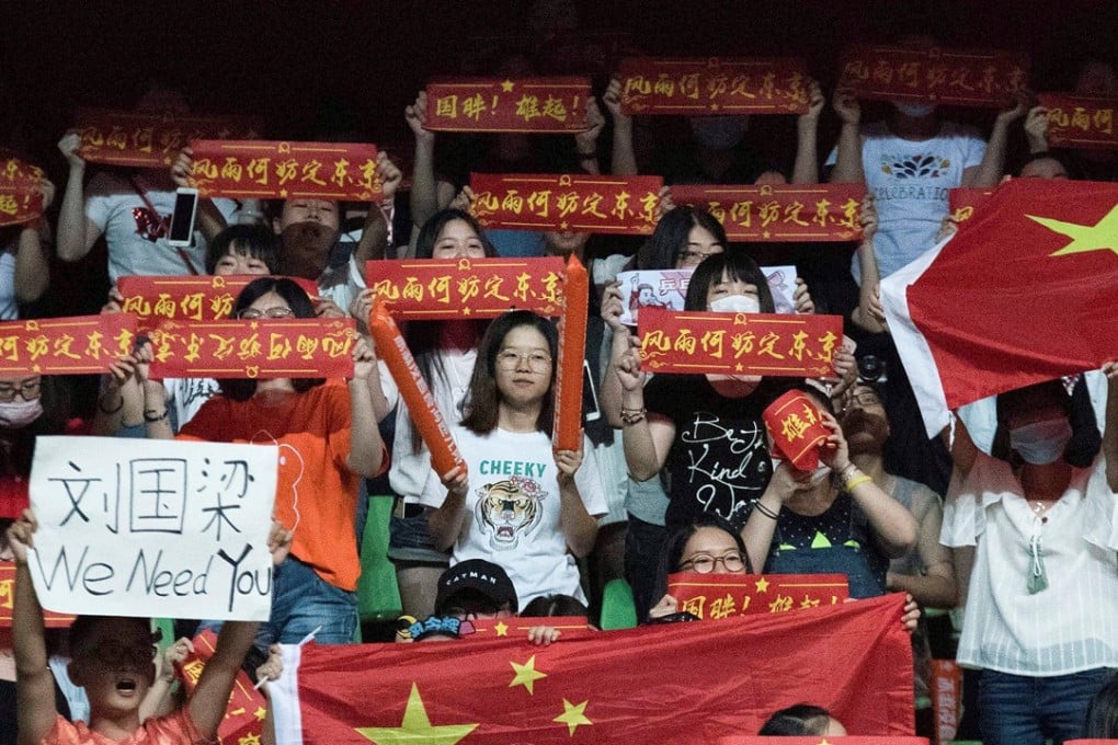 China table tennis fans hold up banners to support former coach Liu Guoliang. Photo: Reuters