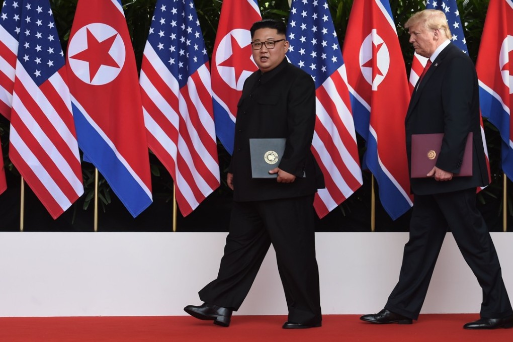 US President Donald Trump walks out with North Korea's leader Kim Jong-un after taking part in a signing ceremony at the end of their historic US-North Korea summit, at the Capella Hotel on Sentosa island. Photo: AFP