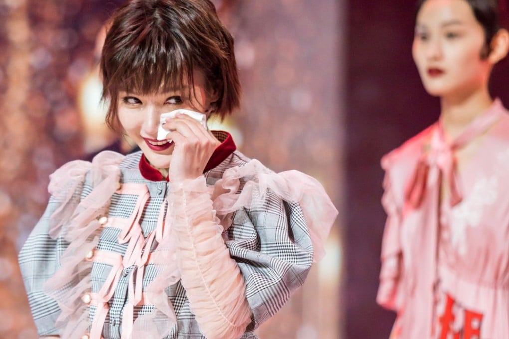 Fashion Master contestant Kate Han Wen wipes away a tear during an episode of the CCTV reality show.
