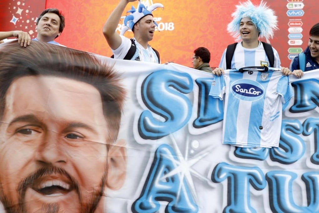 Argentina fans hold a Lionel Messi banner. Photo: Kyodo