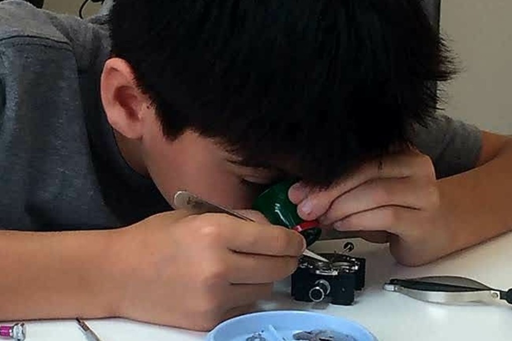 Assembling a watch movement teaches students about precision and meticulousness.