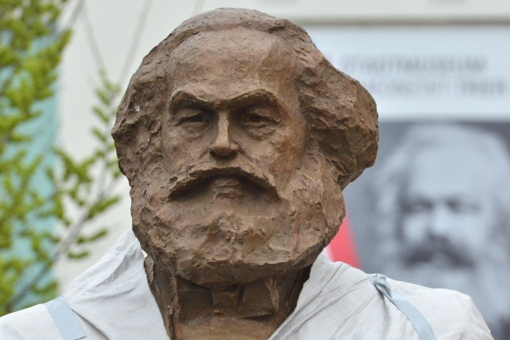 A partly covered statue of Karl Marx is displayed in Trier, Germany, in April this year, before its inauguration in May. The statue, created by Chinese artist Wu Weishan, is a gift from China to mark the 200th anniversary of Marx’s birth. Photo: AFP