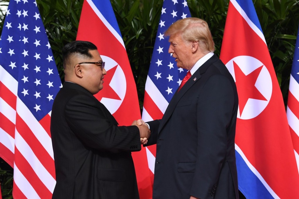 North Korean leader Kim Jong-un shakes hands with US President Donald Trump at the start of their historic summit, at the Capella Hotel on Sentosa island in Singapore, on June 12. Brutal dictators are always happy to be pictured next to world leaders for the same reasons that we should be restrained in granting their requests – such photos grant international legitimacy. Photo: AFP