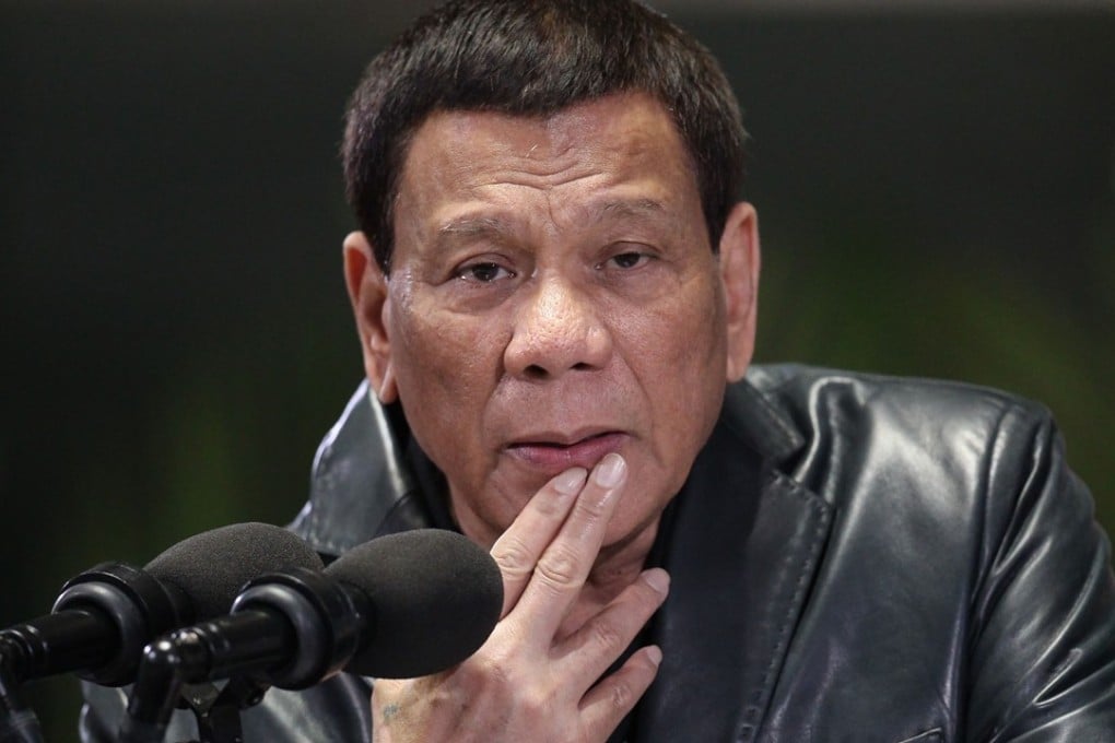A group of left-wing activists heckled and disrupted a televised Independence Day speech Tuesday by the Philippine President Rodrigo Duterte and called him a “traitor” amid criticism of his handling of territorial disputes with China. Photo: AFP