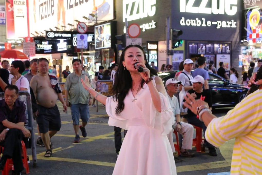 Performers may soon have to leave Sai Yeung Choi Street South in the Mong Kok pedestrian zone, after the district council voted to reopen it to traffic. Photo: K.Y. Cheng