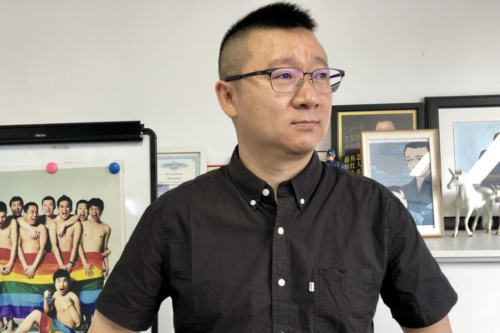 Ma Baoli,who goes by the pseudonym Geng Le, stands in the hallway at the Blued Headquarters in Beijing. Photo: Xinyan Yu