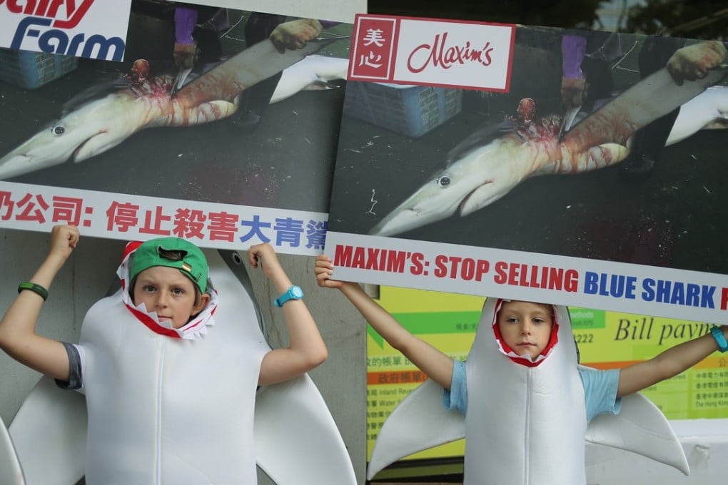 Wildlife activists and children from WildAid stage a protest at Maxim’s Restaurant in Central. Photo: Winson Wong