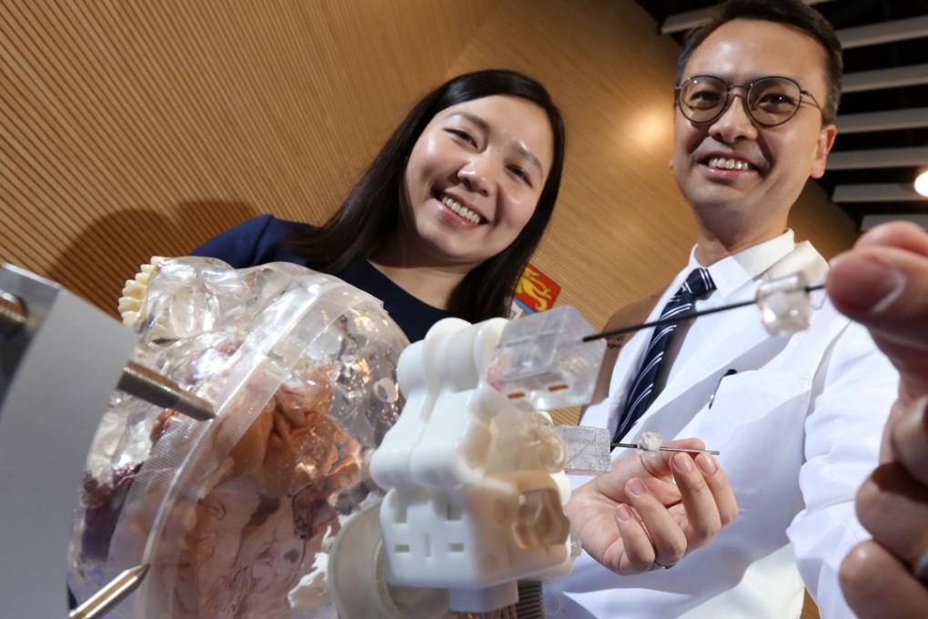 HKU PhD candidate Guo Ziyan and consultant neurosurgeon Dr Danny Chan Tat-ming unveil the innovation at the University of Hong Kong in Pok Fu Lam. Photo: Felix Wong