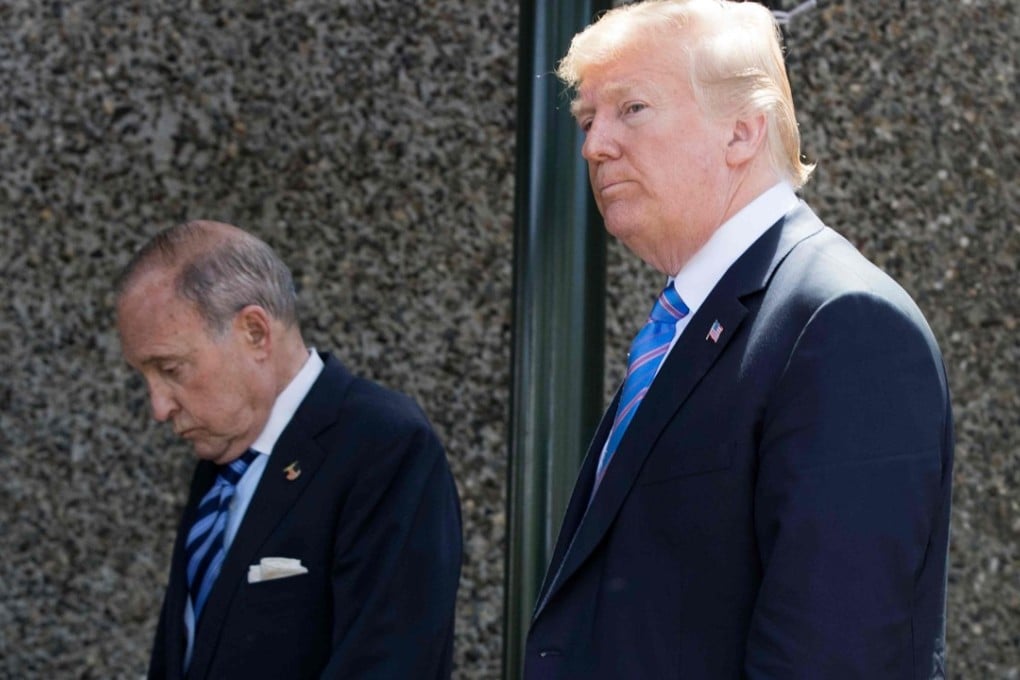 US President Donald Trump, with Director of the National Economic Council National Larry Kudlow (L), leaves the G7 summit in La Malbaie, Quebec. Photo: AFP