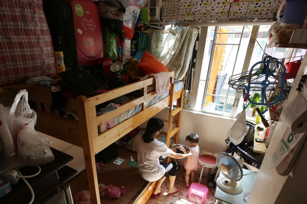 A mother and her child in their subdivided flat home in Sham Shui Po in October 2016. Photo: Edward Wong