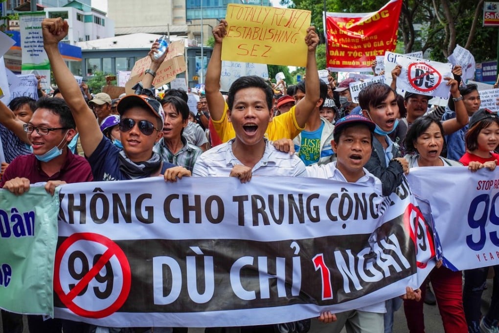 Vietnamese protest in Ho Chi Minh City on Sunday over a proposal to grant companies 99-year land leases in special economic zones. Photo: AFP