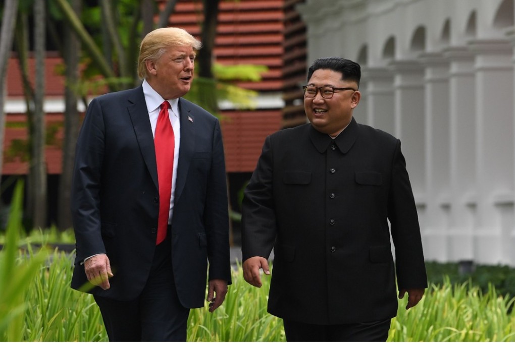Donald Trump and Kim Jong-un during a break in talks at the Capella Hotel in Singapore on Tuesday. Photo: AFP