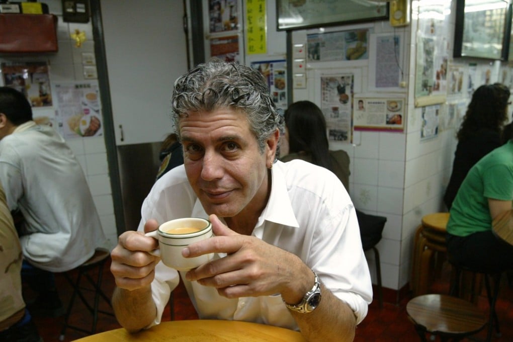 Celebrity chef Anthony Bourdain enjoys a Hong Kong-style milk tea at a Hong Kong restaurant in 2005.