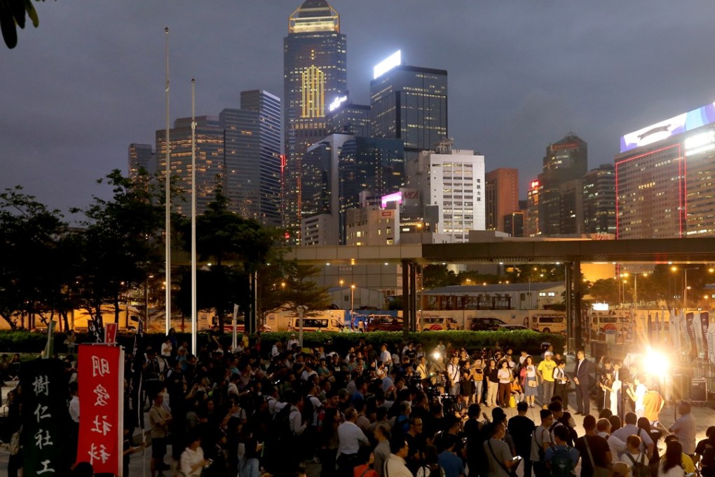 In the lead-up to the crucial vote, a group of about 300 demonstrators gathered outside the Legislative Council at Tamar to watch a live broadcast of the meeting inside. Photo: Dickson Lee