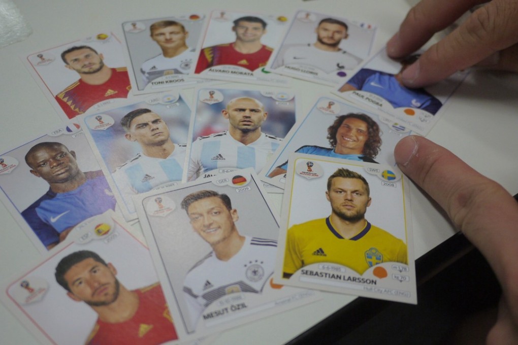 A Panini World Cup collector shows off some of his stickers at City University. Photos: Nicolas Atkin
