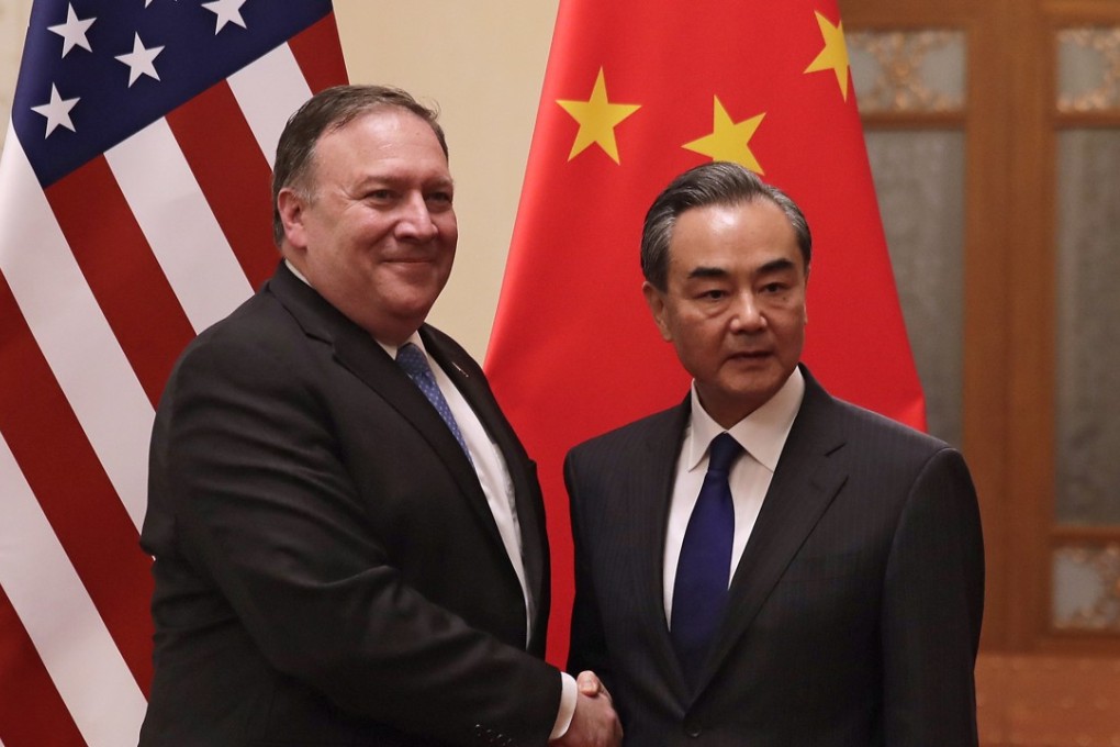 US Secretary of State Mike Pompeo (left) shakes hands with Chinese Foreign Minister Wang Yi at the Great Hall of the People in Beijing on Thursday. Photo: EPA-EFE