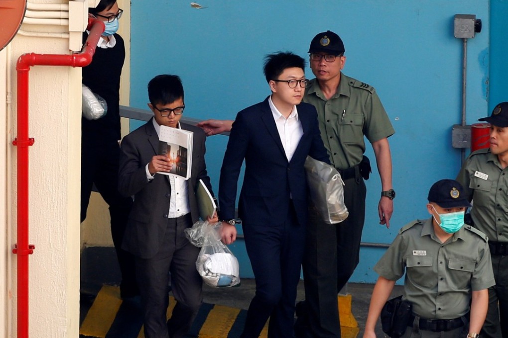Pro-independence activist Edward Leung, along with defendants Lo Kin-man (second from left) and Wong Ka-kui (left), walk inside a detention centre before leaving for the High Court for a sentencing hearing in Hong Kong on Monday. Photo: Reuters