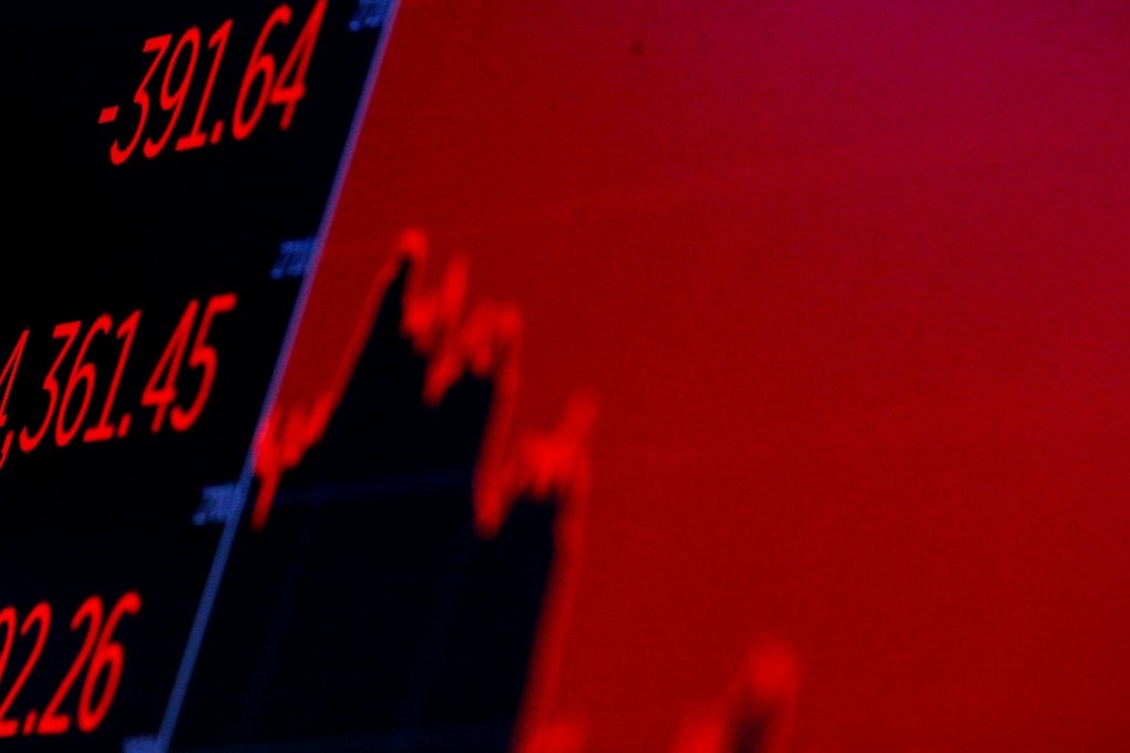 The Dow Jones Industrial Average is displayed on a screen after the closing bell at the New York Stock Exchange on May 29. The US market has risen continually since the last few months of 2017, nudged by a falling dollar, but mainly because of Donald Trump’s huge tax breaks to corporate America. Photo: Reuters